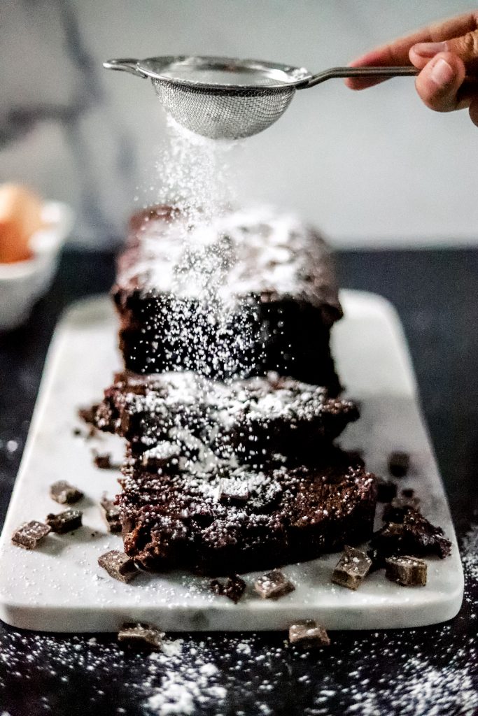 Chocolate loaf with powdered sugar ontop.