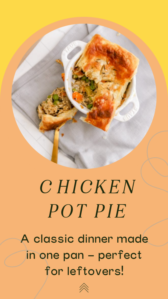 Chicken pot pie in a white ramekin with a golden fork on a gray napkin