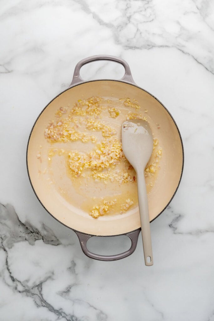 Cooking artichoke risotto.