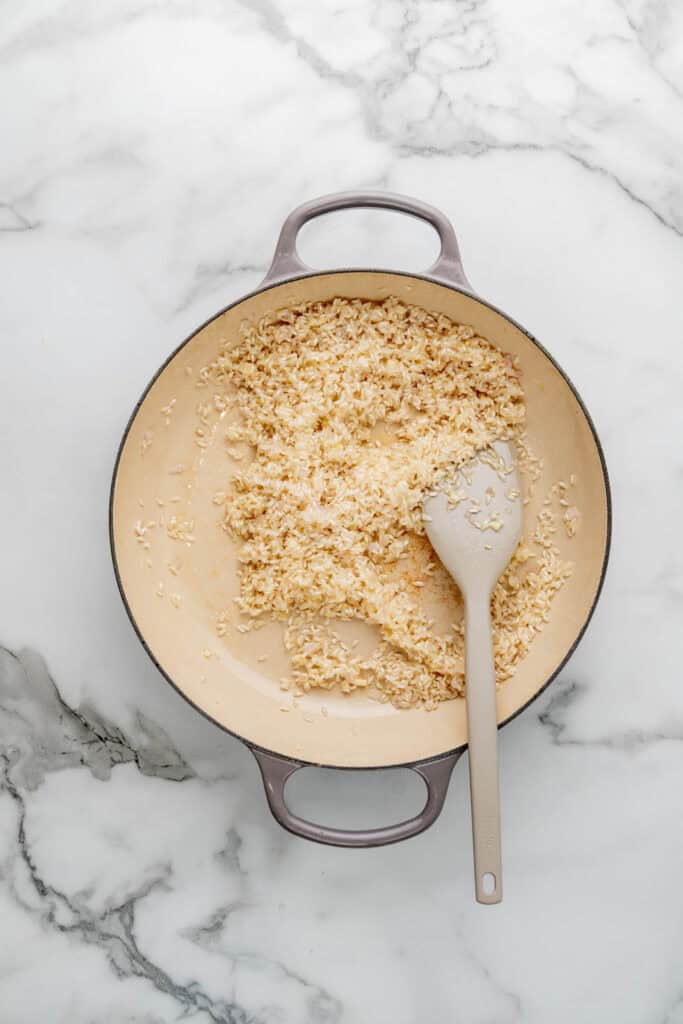 Cooking artichoke risotto.