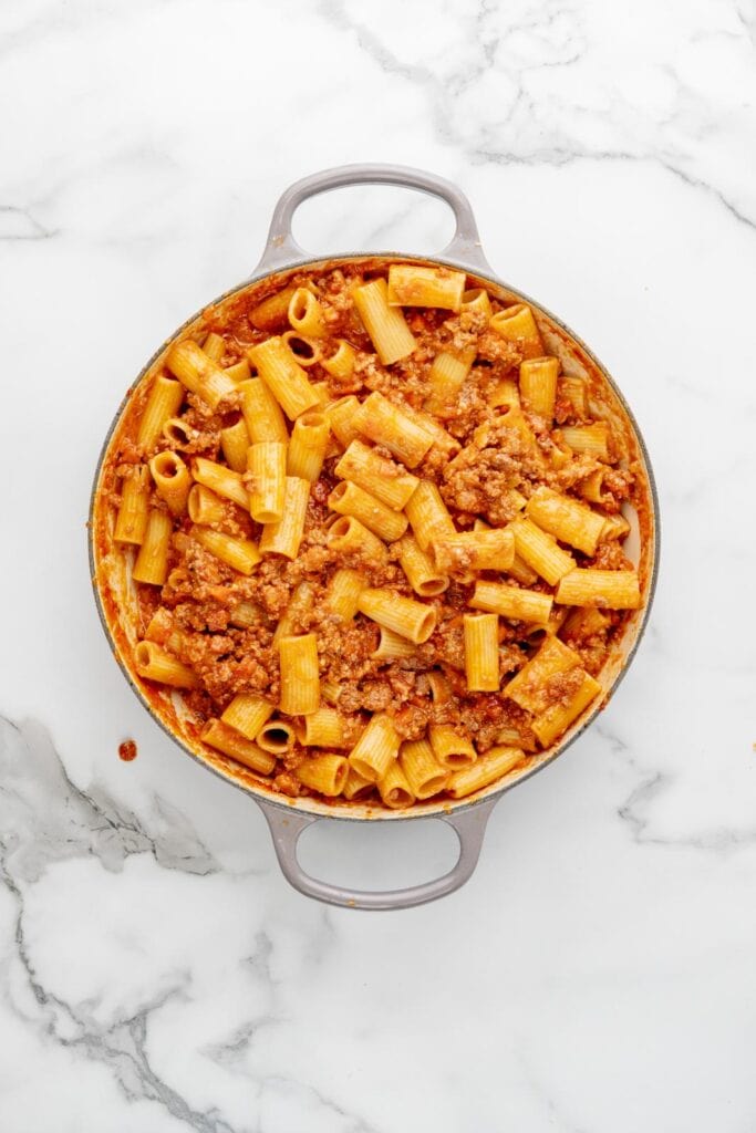 Preparing baked bolognese.