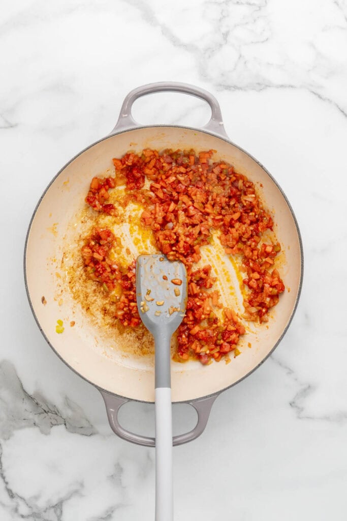Cooking the base for baked bolognese.