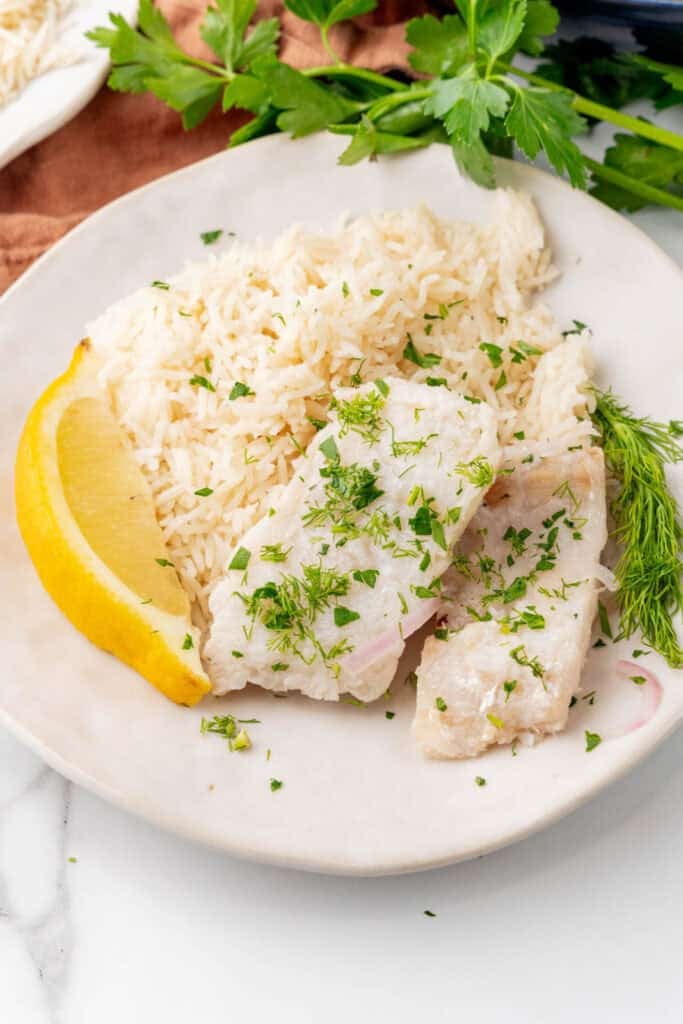 Poached cod with herbs and lemon.