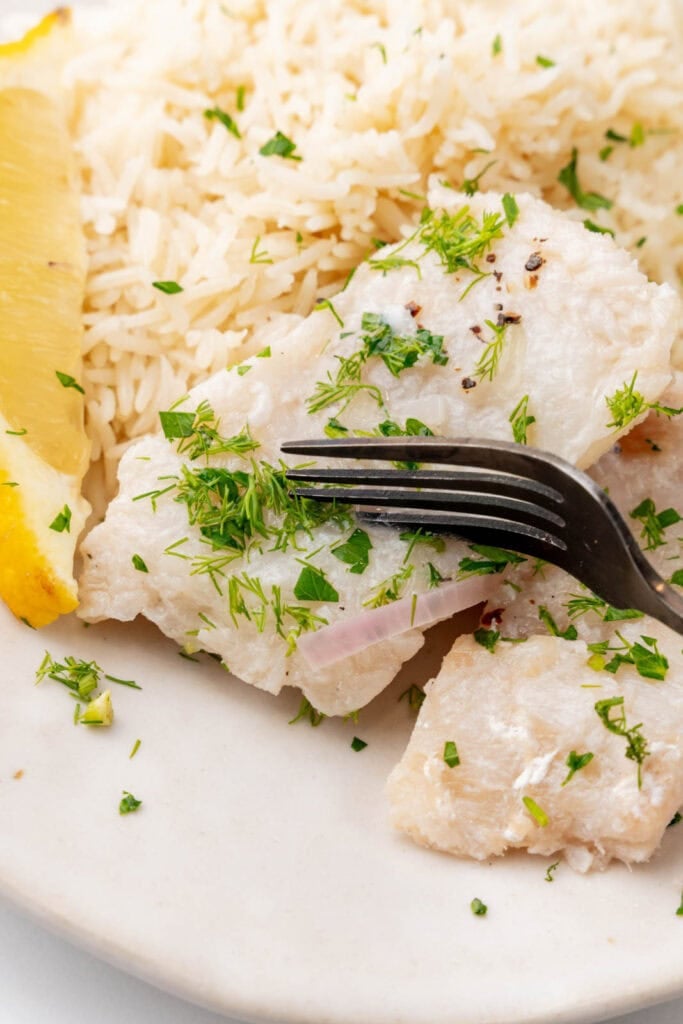 Poached cod with herbs and lemon.