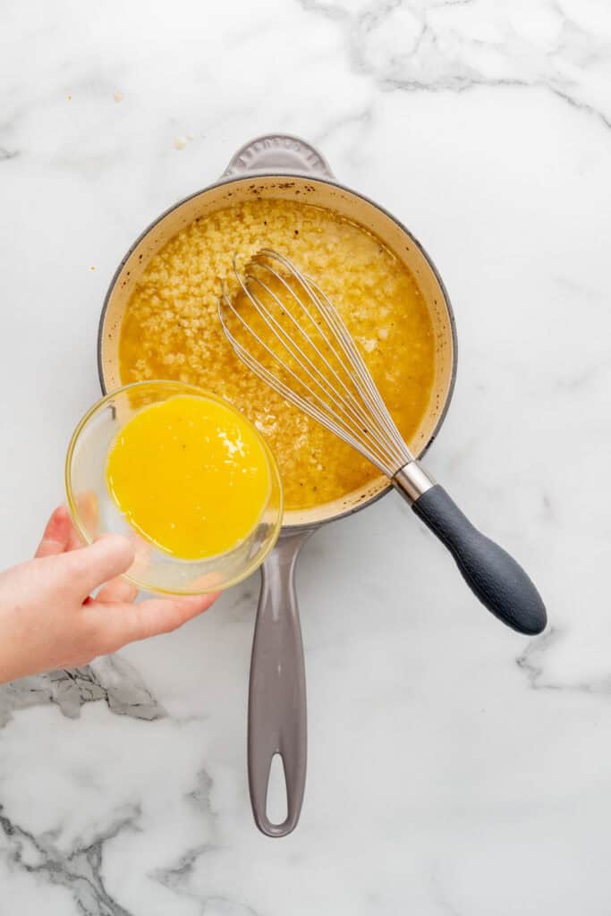 Adding tempered eggs to an easy pastina.
