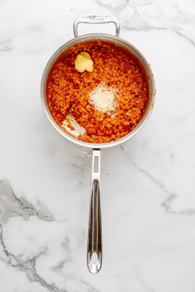 Making creamy tomato pastina.