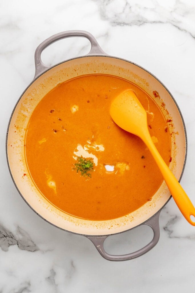 Making a red coconut curry.