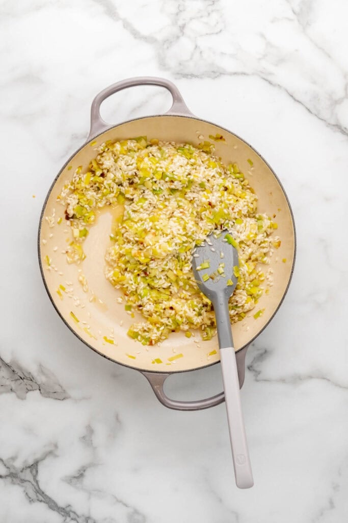 Cooking the base of a spring risotto.
