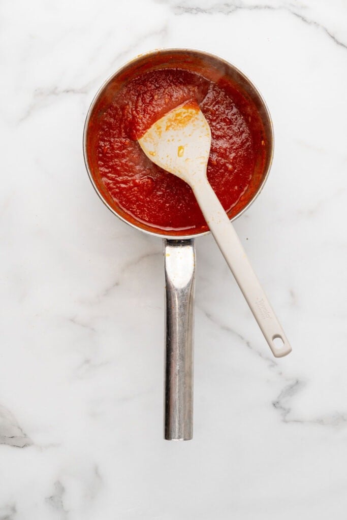 Making bravas sauce for salmon and potatoes.