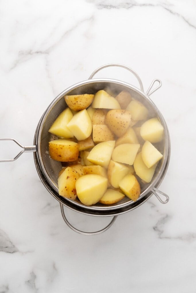 Potatoes in a colander.