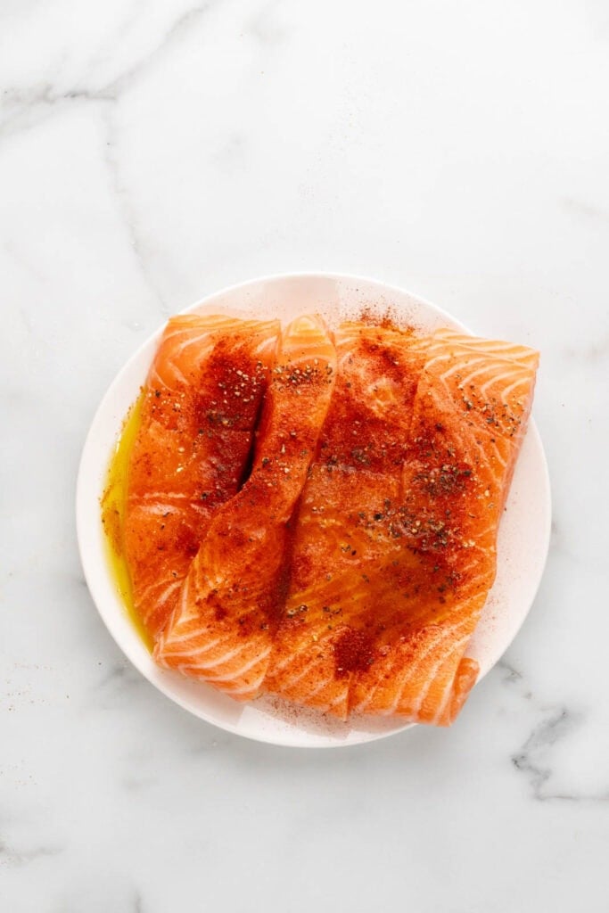 Salmon seasoned with paprika.