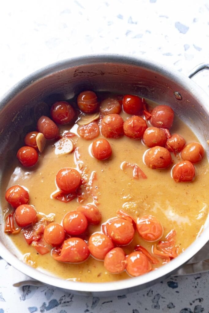 Pan sauce with blistered cherry tomatoes.