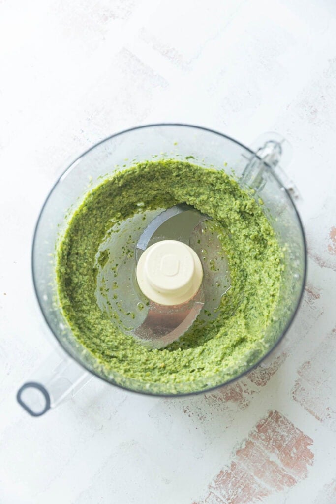 Making pesto in a food processor.