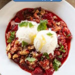 A strawberry crumble with ice cream.